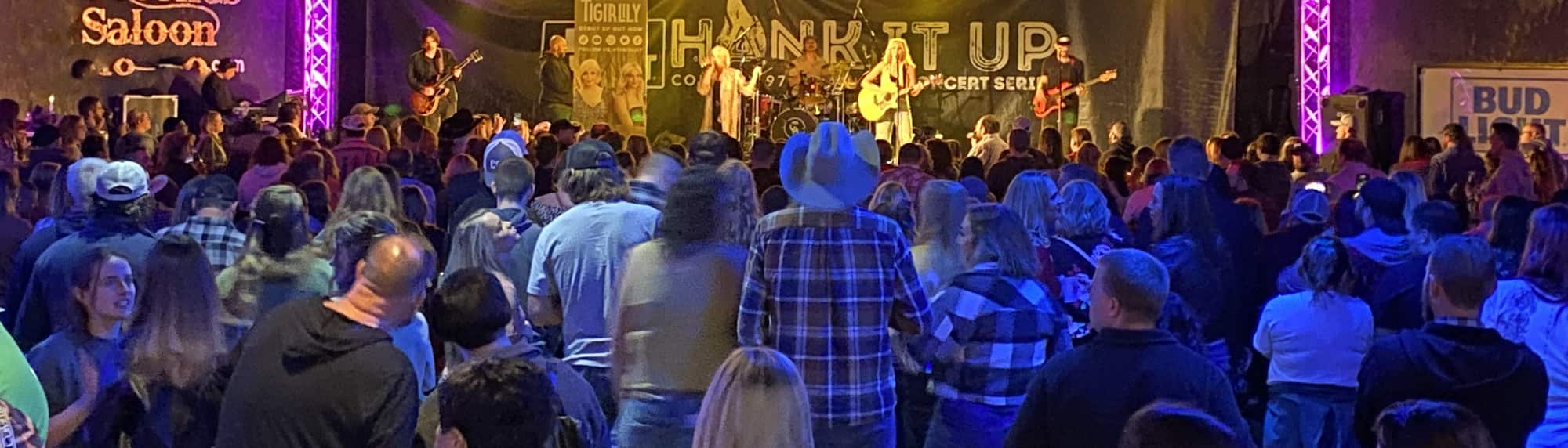 country concert with fans wearing cowboy hats Lincoln