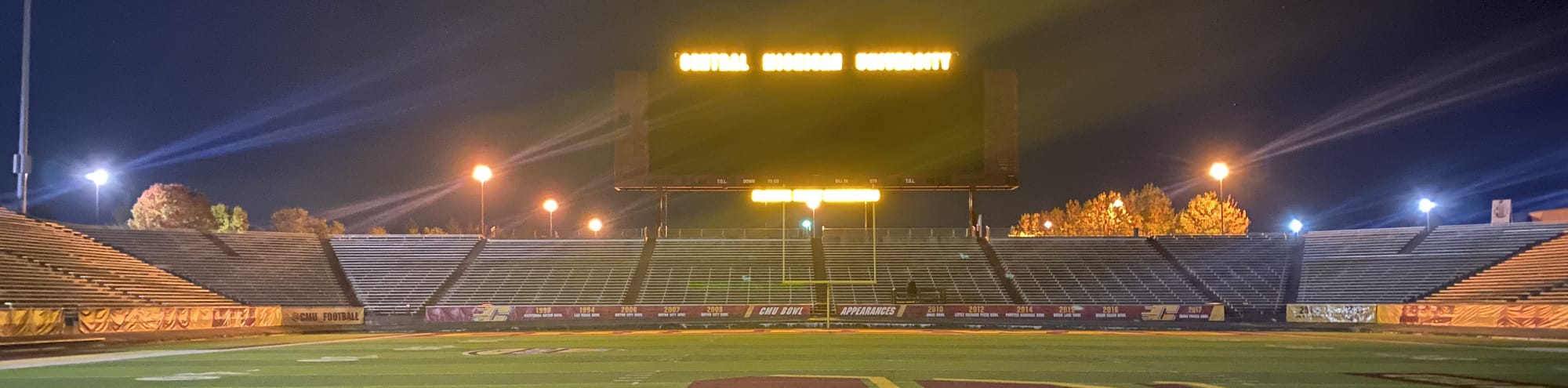 empty football stadium at night under the lights Lincoln